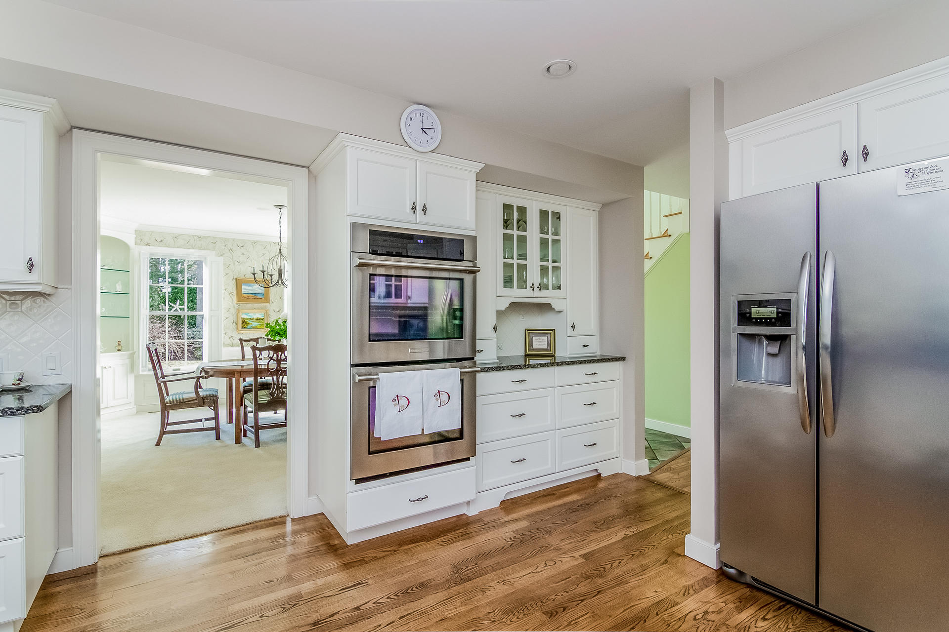 21 Marshview Lane Brewster, MA 02631 - Photo 13 of 37 a kitchen with stainless steel appliances a refrigerator and wooden cabinets