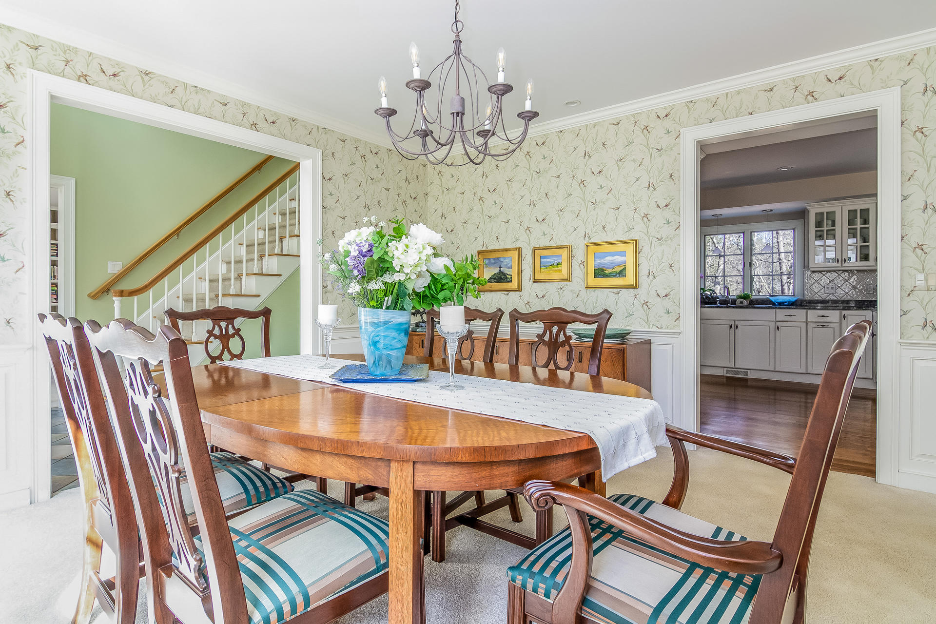 21 Marshview Lane Brewster, MA 02631 - Photo 15 of 37 a view of a dining room with furniture and chandelier