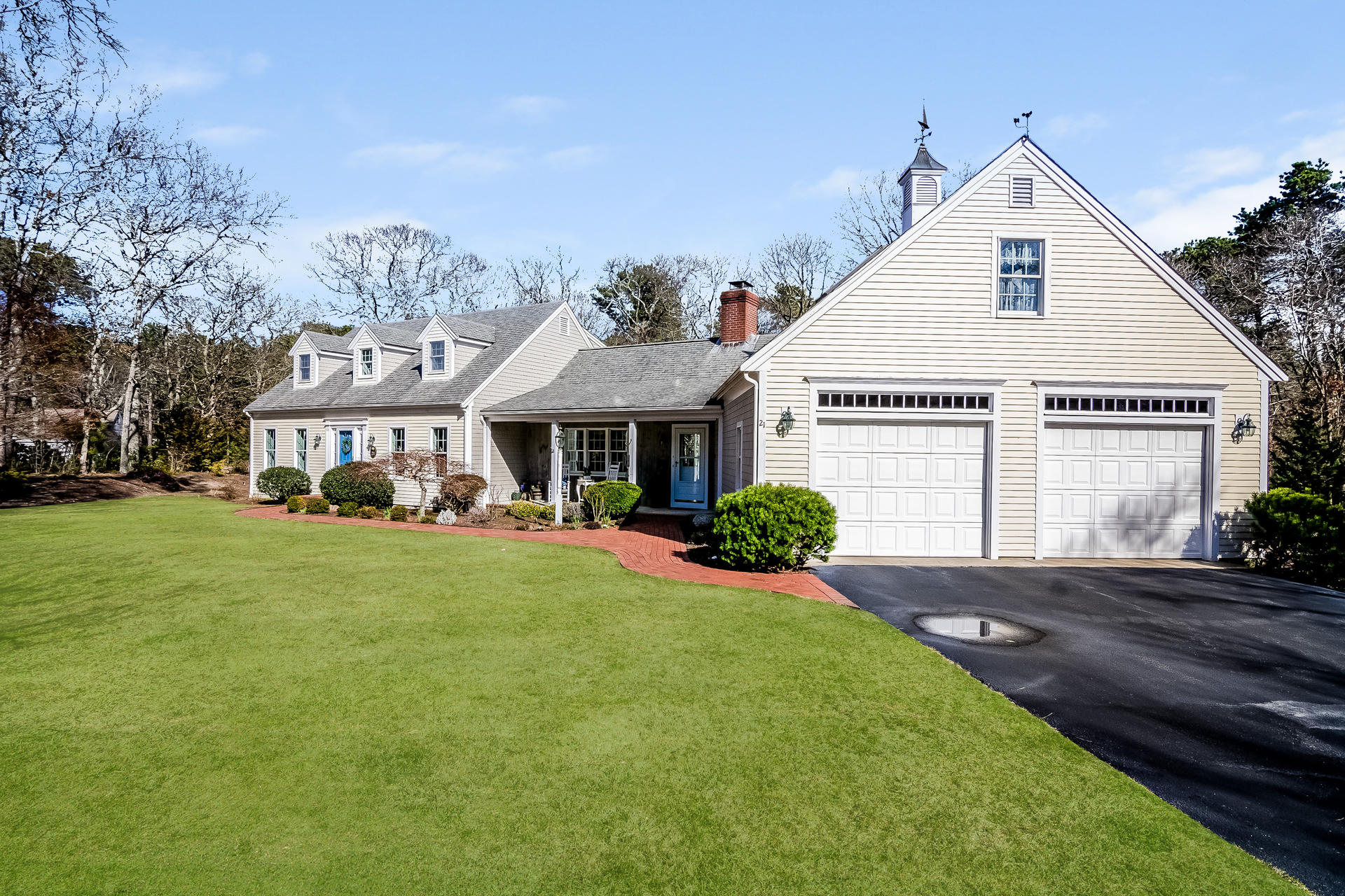 21 Marshview Lane Brewster, MA 02631 - Photo 2 of 37 a front view of a house with a yard