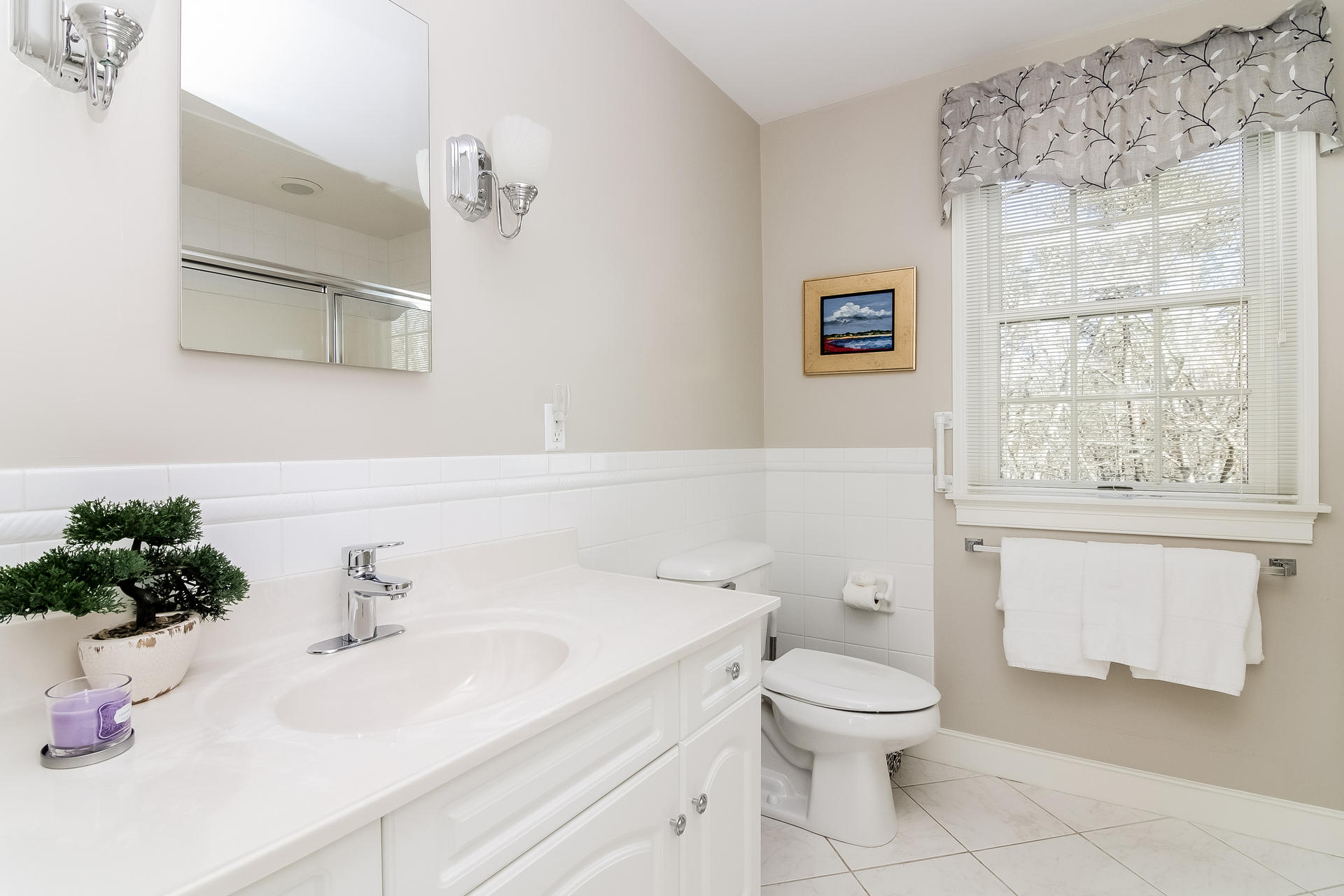21 Marshview Lane Brewster, MA 02631 - Photo 24 of 37 a bathroom with a sink a toilet and a mirror