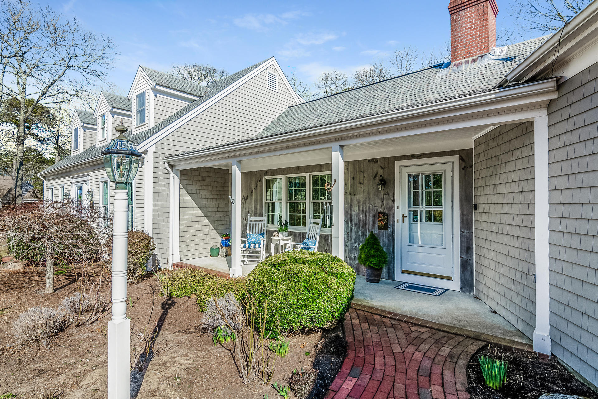 21 Marshview Lane Brewster, MA 02631 - Photo 3 of 37 a front view of a house with garden