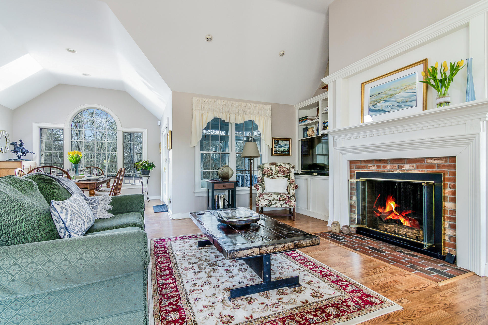 21 Marshview Lane Brewster, MA 02631 - Photo 5 of 37 a living room with furniture and a fireplace