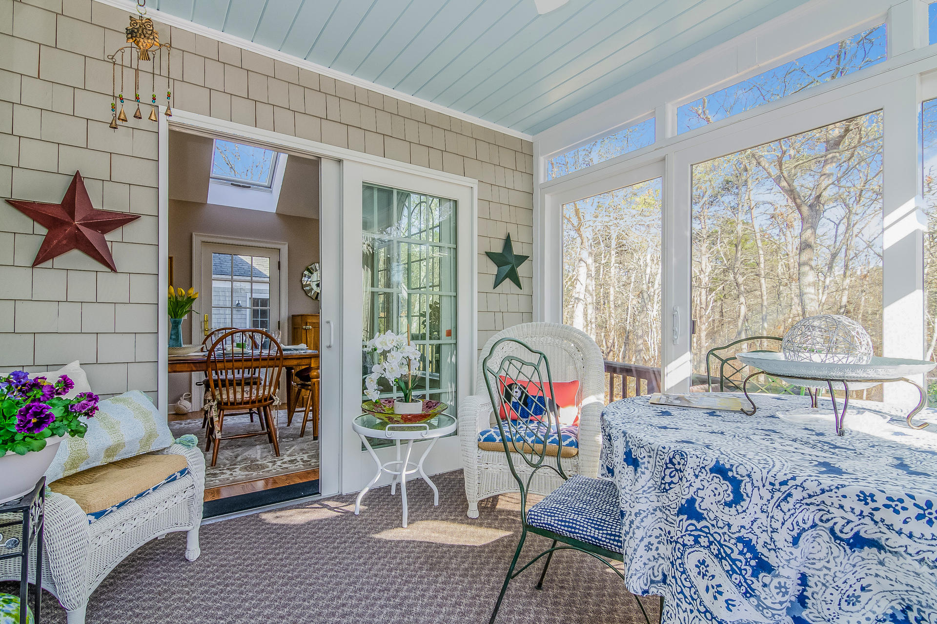 21 Marshview Lane Brewster, MA 02631 - Photo 7 of 37 a living room filled with furniture and a table