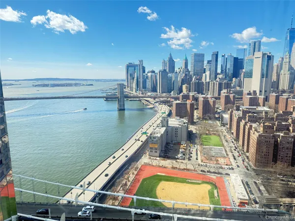 a view of a balcony with dining table and chairs