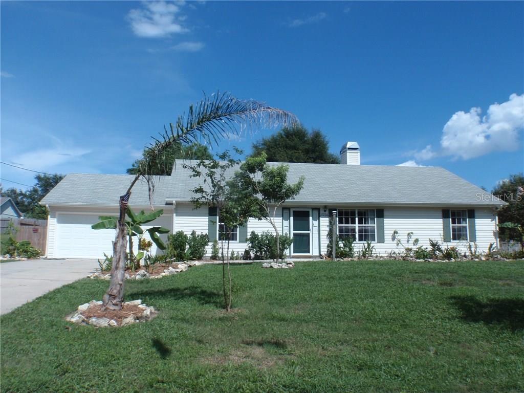 17236 3rd Street Montverde, FL 34756 - Photo 1 of 1 a front view of a house with a yard