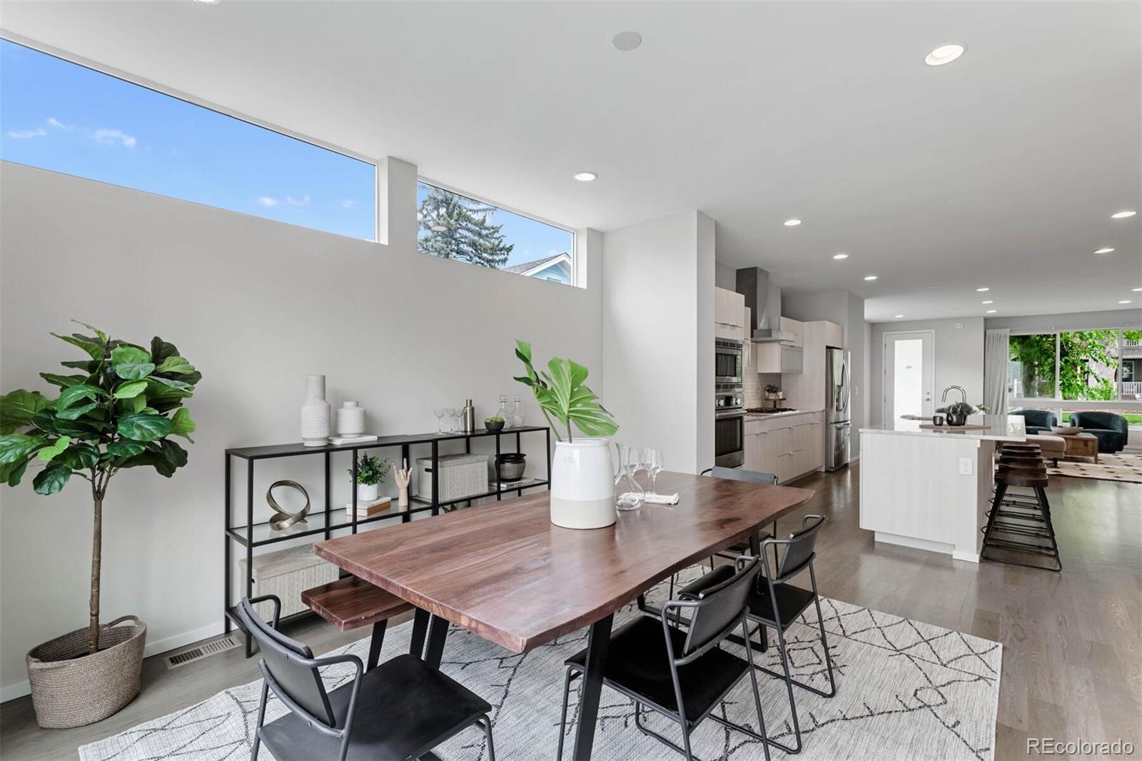 4011 Raleigh Street Denver, CO 80212 - Photo 12 of 34 a view of a dining room with furniture and wooden floor