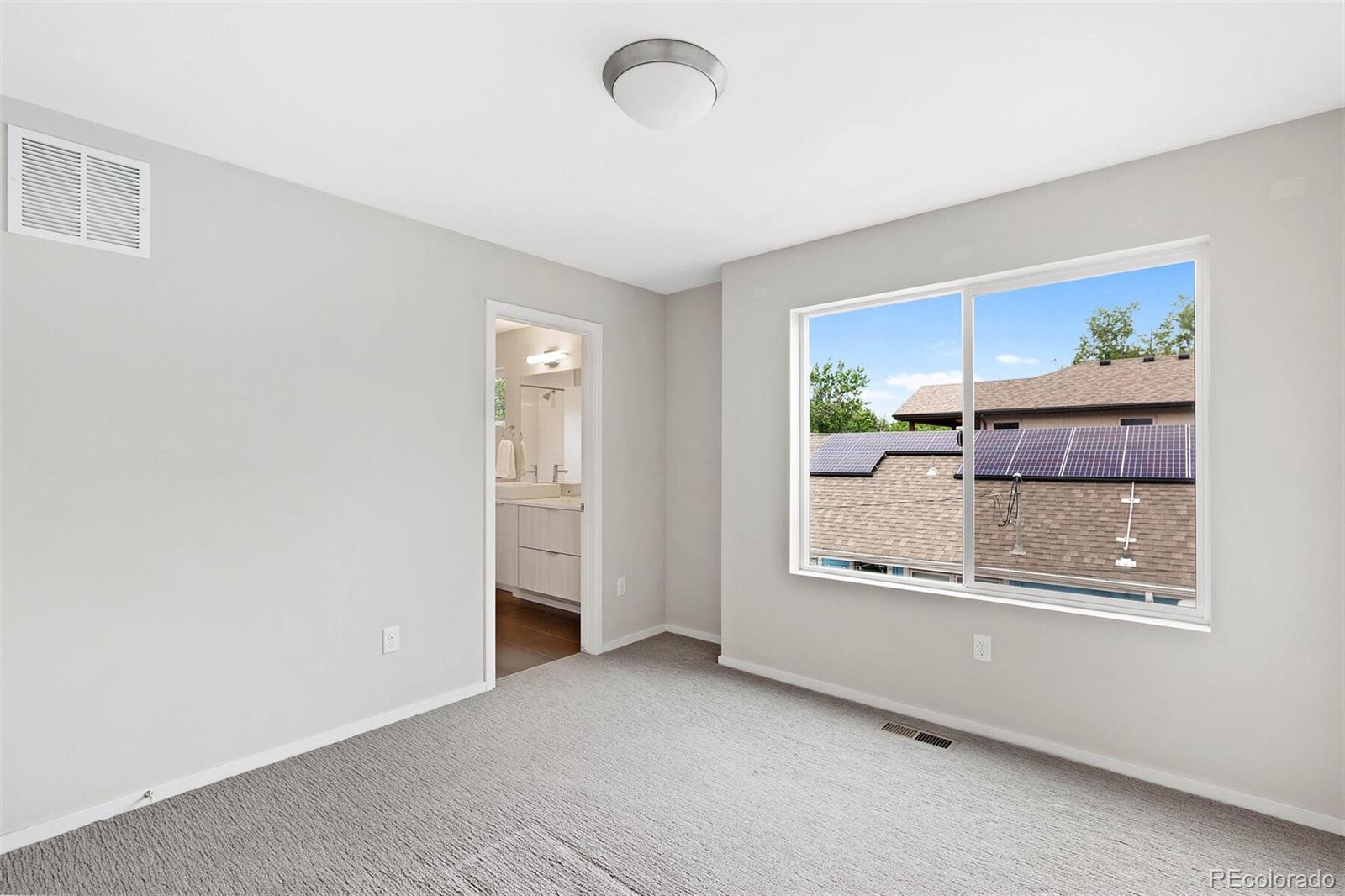 4011 Raleigh Street Denver, CO 80212 - Photo 20 of 34 an empty room with windows and cabinet