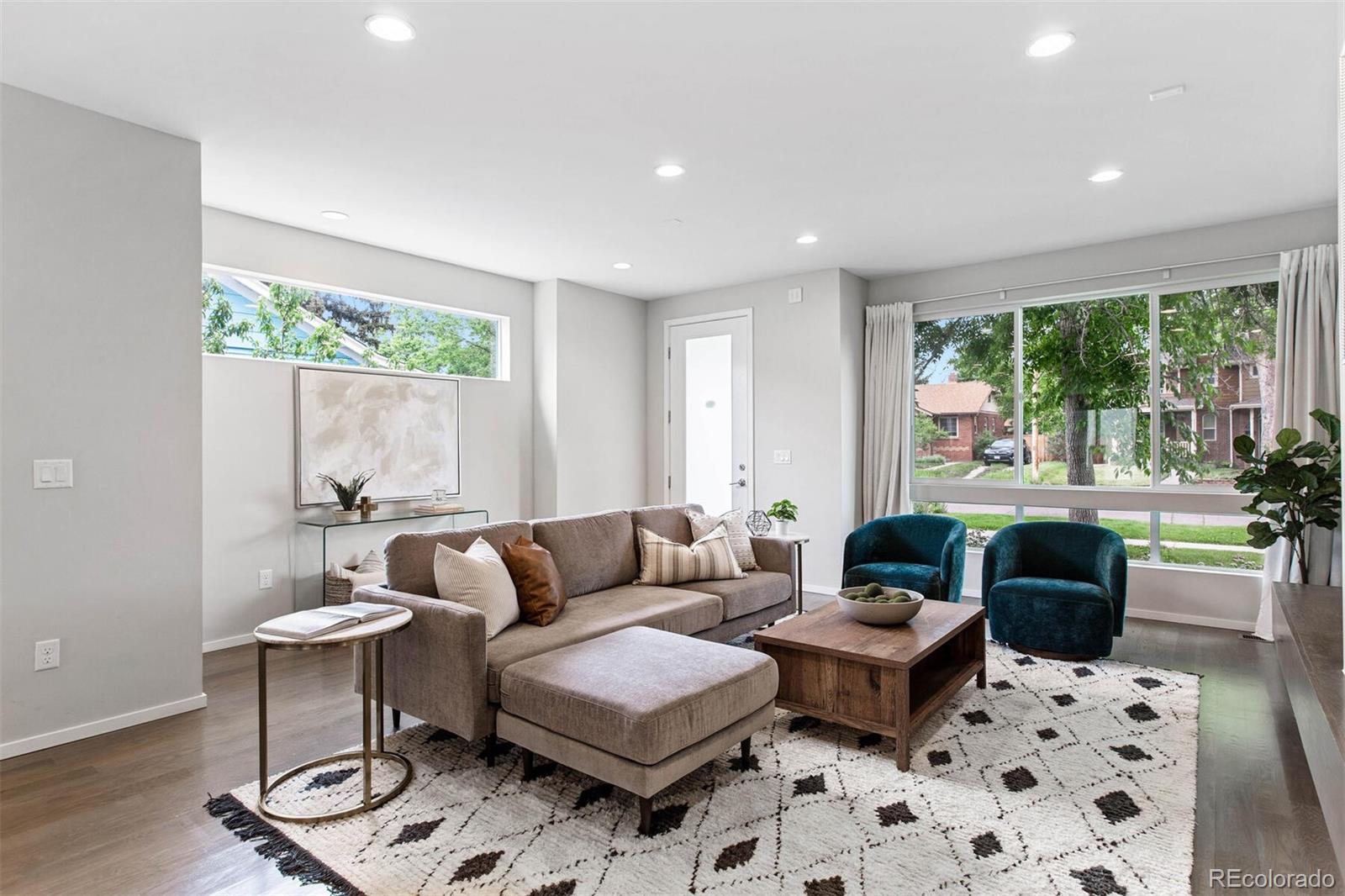 4011 Raleigh Street Denver, CO 80212 - Photo 2 of 34 a living room with furniture and a large window