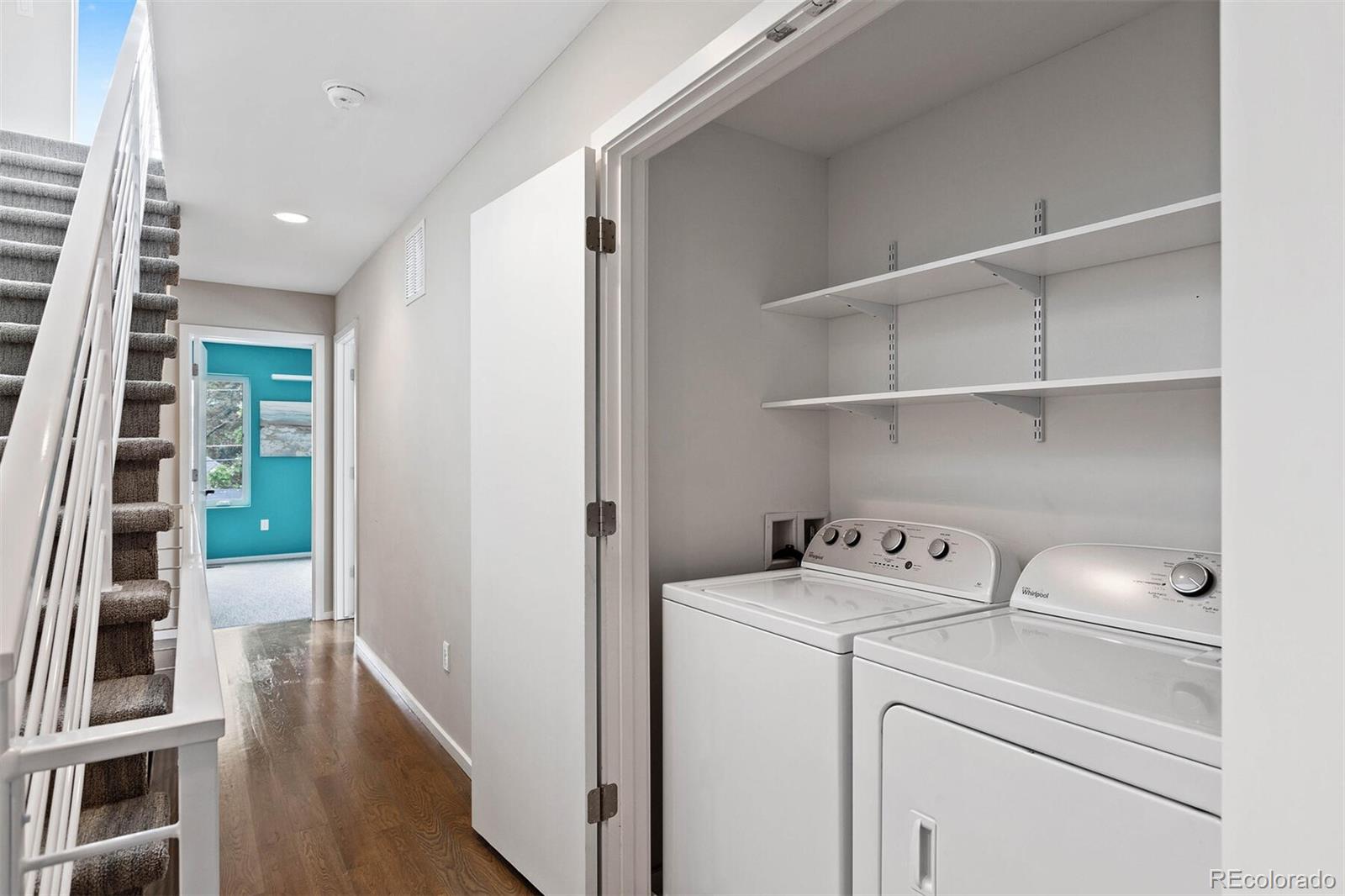 4011 Raleigh Street Denver, CO 80212 - Photo 21 of 34 a view of washer and dryer with wooden floor