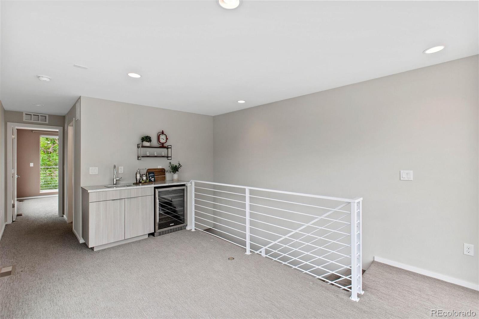 4011 Raleigh Street Denver, CO 80212 - Photo 22 of 34 a view of a kitchen with furniture and cabinets