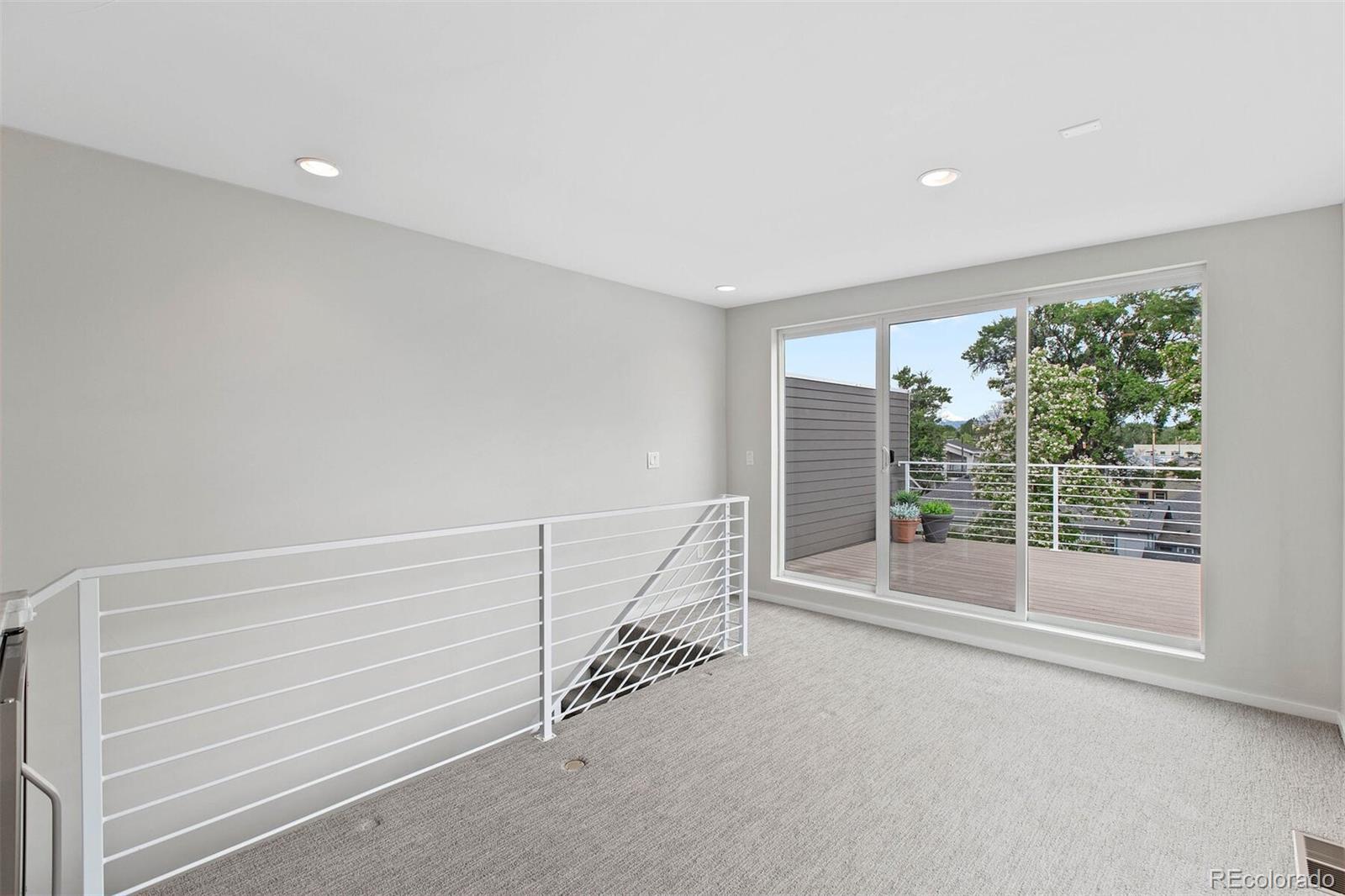 4011 Raleigh Street Denver, CO 80212 - Photo 24 of 34 a view of an empty room with a window