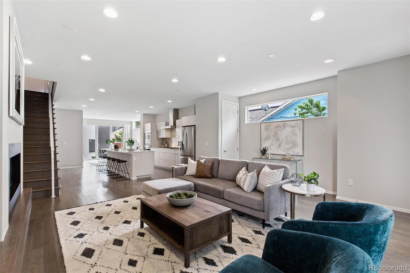 4011 Raleigh Street Denver, CO 80212 - Photo 3 of 34 a living room with furniture and a rug