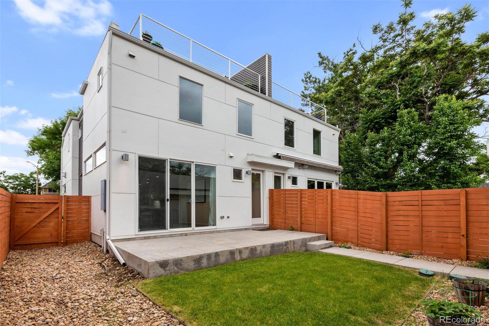 4011 Raleigh Street Denver, CO 80212 - Photo 33 of 34 front view of a house with a yard