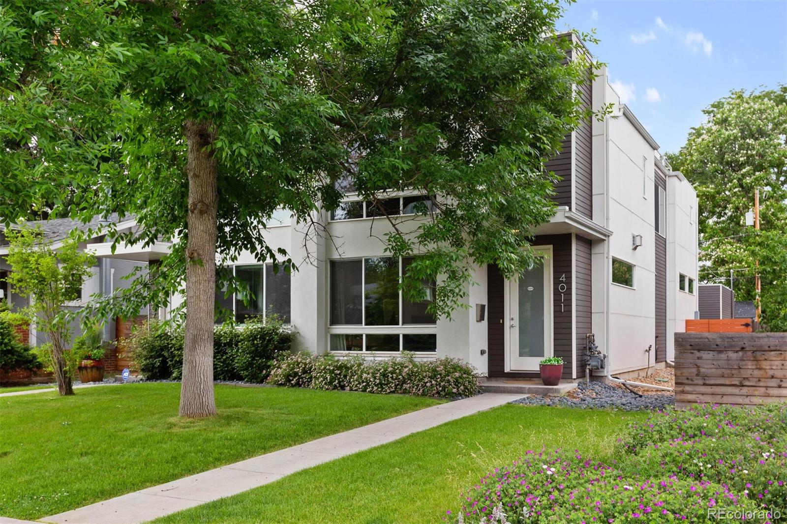 4011 Raleigh Street Denver, CO 80212 - Photo 34 of 34 a view of a house with a yard and plants