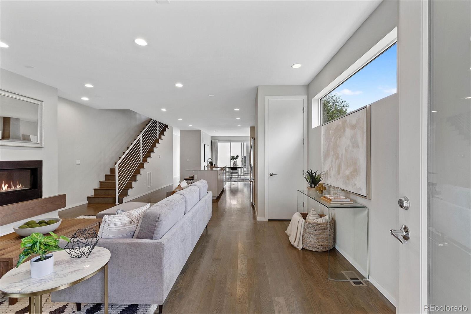 4011 Raleigh Street Denver, CO 80212 - Photo 4 of 34 a living room with furniture and a wooden floor