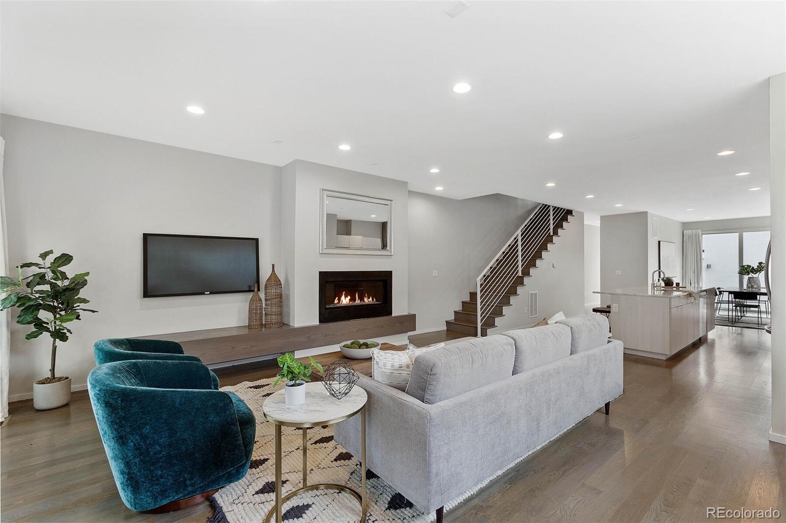 4011 Raleigh Street Denver, CO 80212 - Photo 5 of 34 a living room with furniture and a flat screen tv