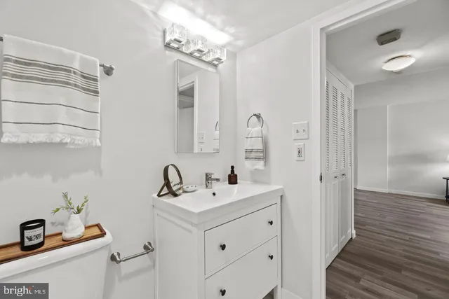 a bathroom with a sink a mirror and shower