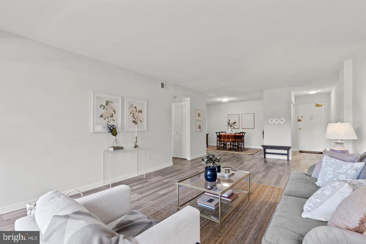 1300 Army Navy Drive, Unit 104 Arlington, VA 22202 - Photo 3 of 19 a living room with furniture and kitchen view