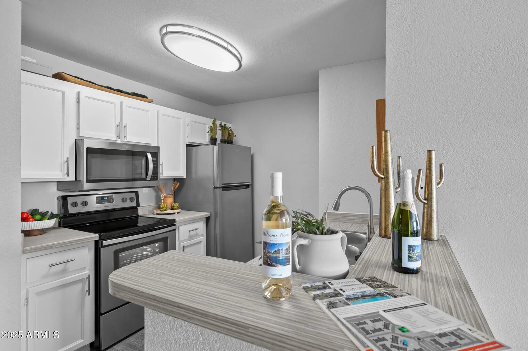 1320 North McQueen Road, Unit B1 Chandler, AZ 85225 - Photo 3 of 13 Kitchen Breakfast Bar