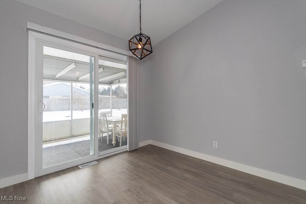 7996 Munson Road Mentor, OH 44060 - Photo 6 of 33 Spare room with hardwood / wood-style floors