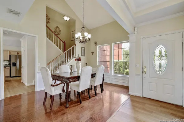 a view of a dining room with furniture window and wooden floor