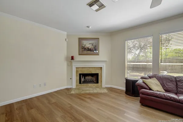 a living room with furniture and a fireplace