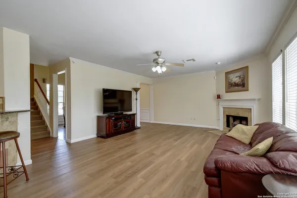 a living room with furniture fireplace and flat screen tv
