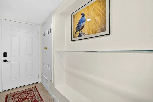 a living room with furniture and dining area