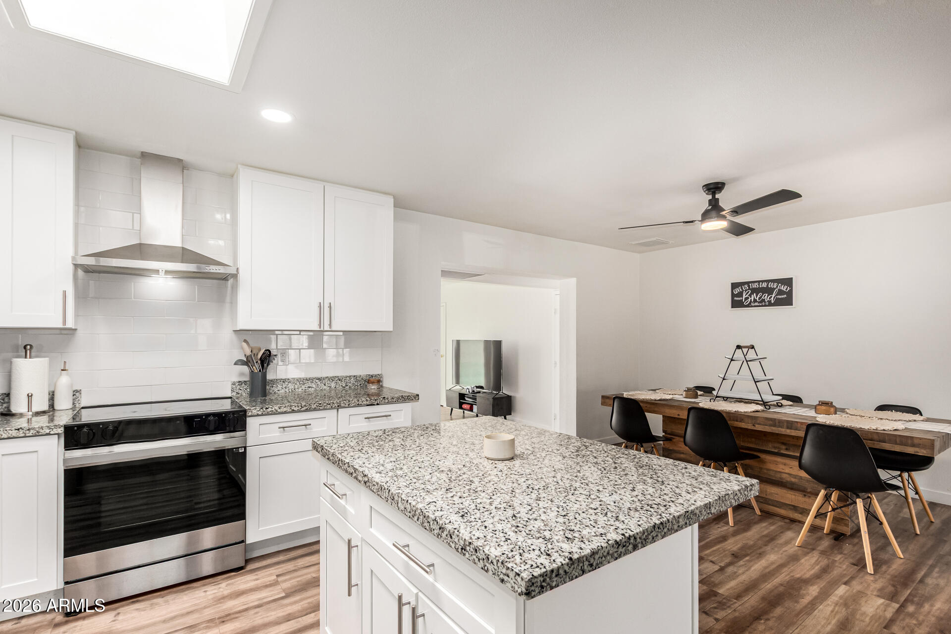 1609 West Mission Lane Phoenix, AZ 85021 - Photo 13 of 36 a kitchen with a stove a refrigerator and a counter top space