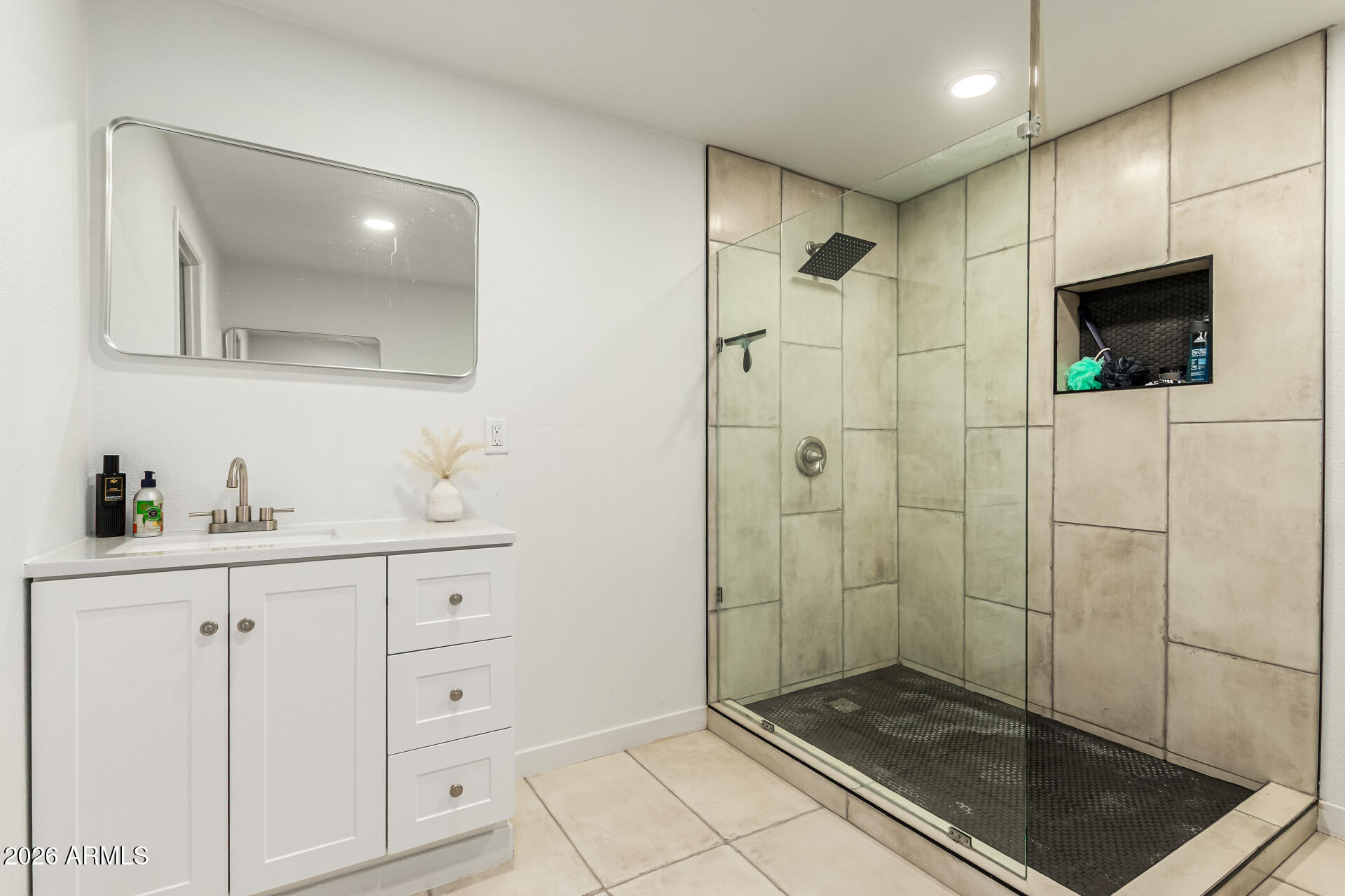 1609 West Mission Lane Phoenix, AZ 85021 - Photo 23 of 36 a bathroom with a shower sink and mirror