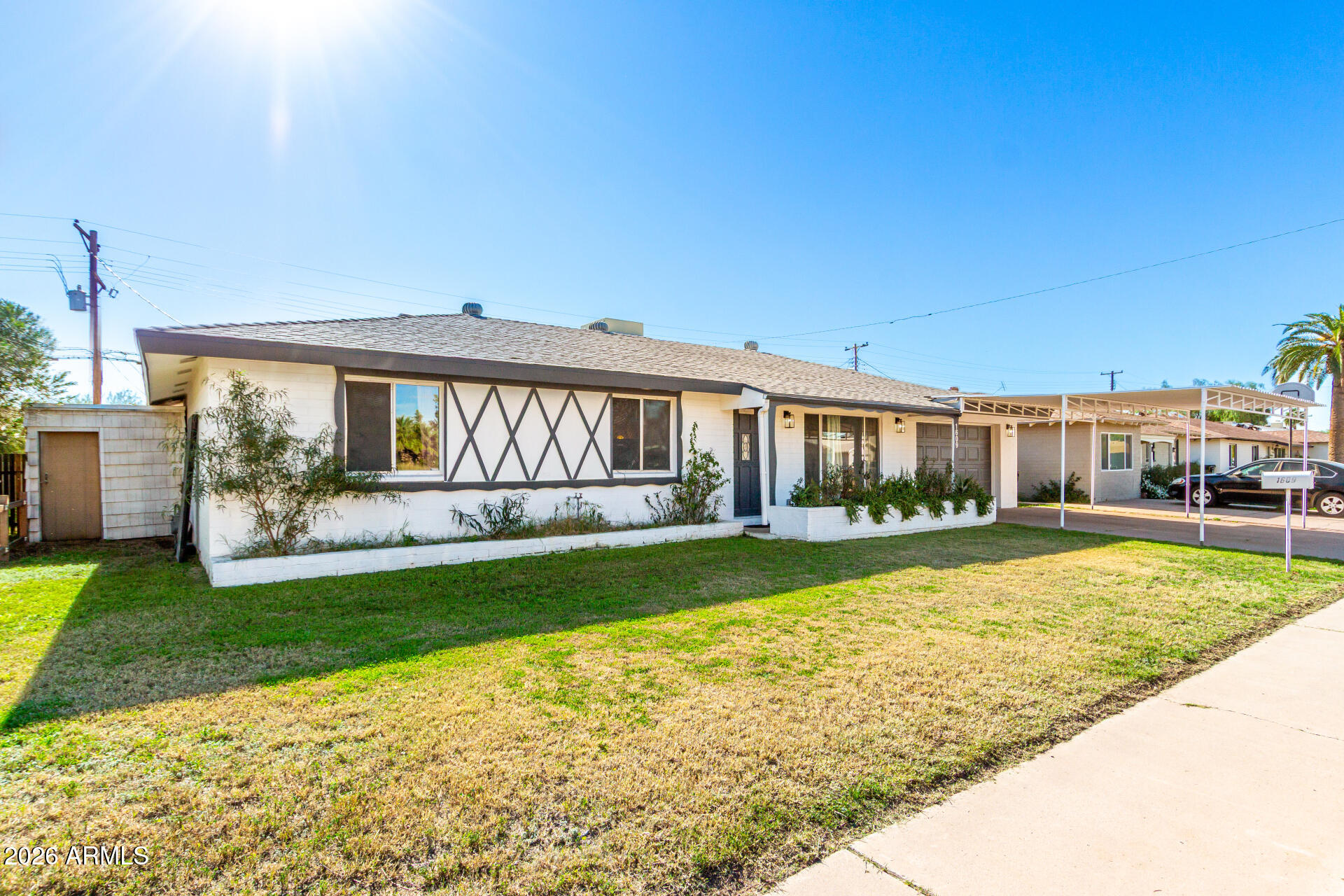 1609 West Mission Lane Phoenix, AZ 85021 - Photo 7 of 36 a view of a house with a yard