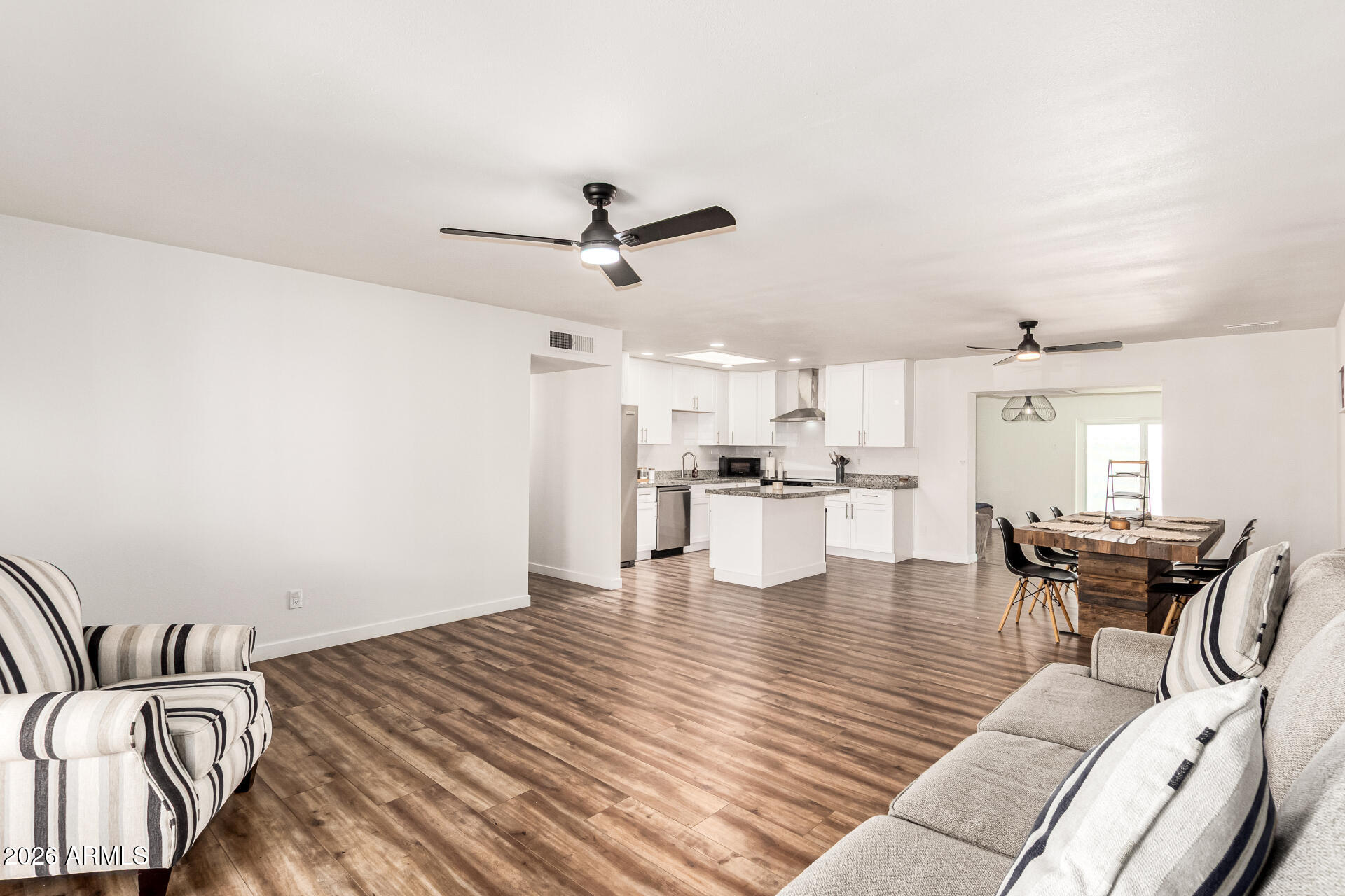 1609 West Mission Lane Phoenix, AZ 85021 - Photo 10 of 36 a living room with furniture and kitchen view