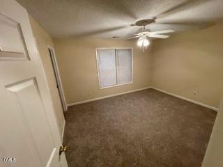 2112 Walnut Bluffs Lane Raleigh, NC 27610 - Photo 8 of 17 en empty room with windows and fan