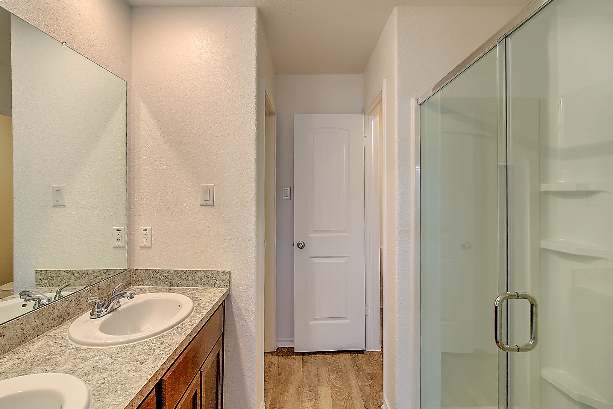 14417 Conifer Drive Conroe, TX 77302 - Photo 11 of 20 a bathroom with a granite countertop sink and a mirror