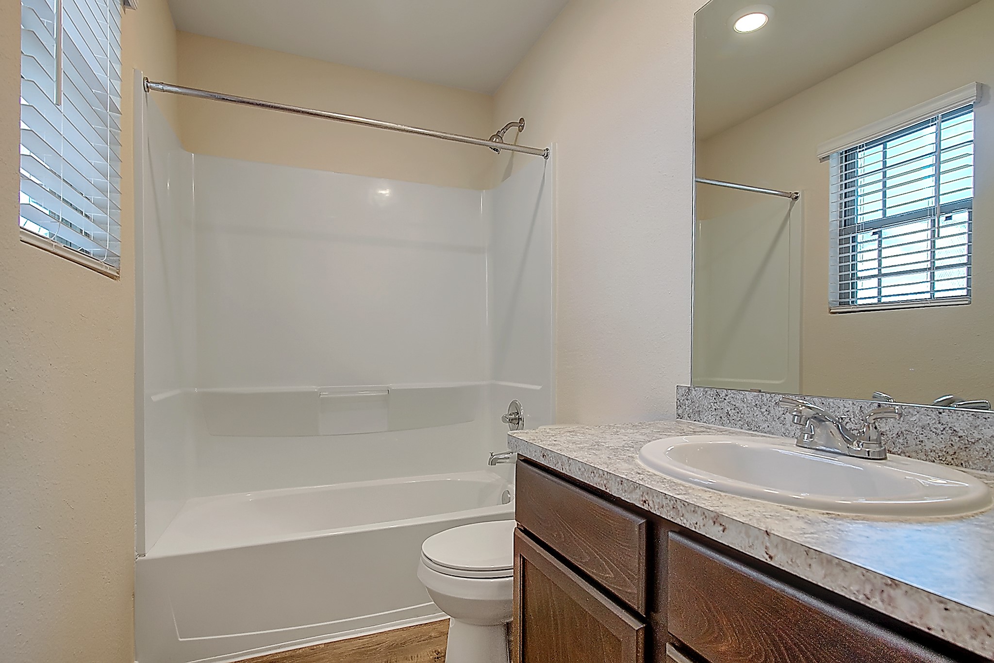 14417 Conifer Drive Conroe, TX 77302 - Photo 16 of 20 a bathroom with a granite countertop sink toilet and shower