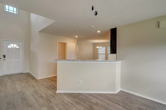 a kitchen with stainless steel appliances granite countertop a stove and a sink