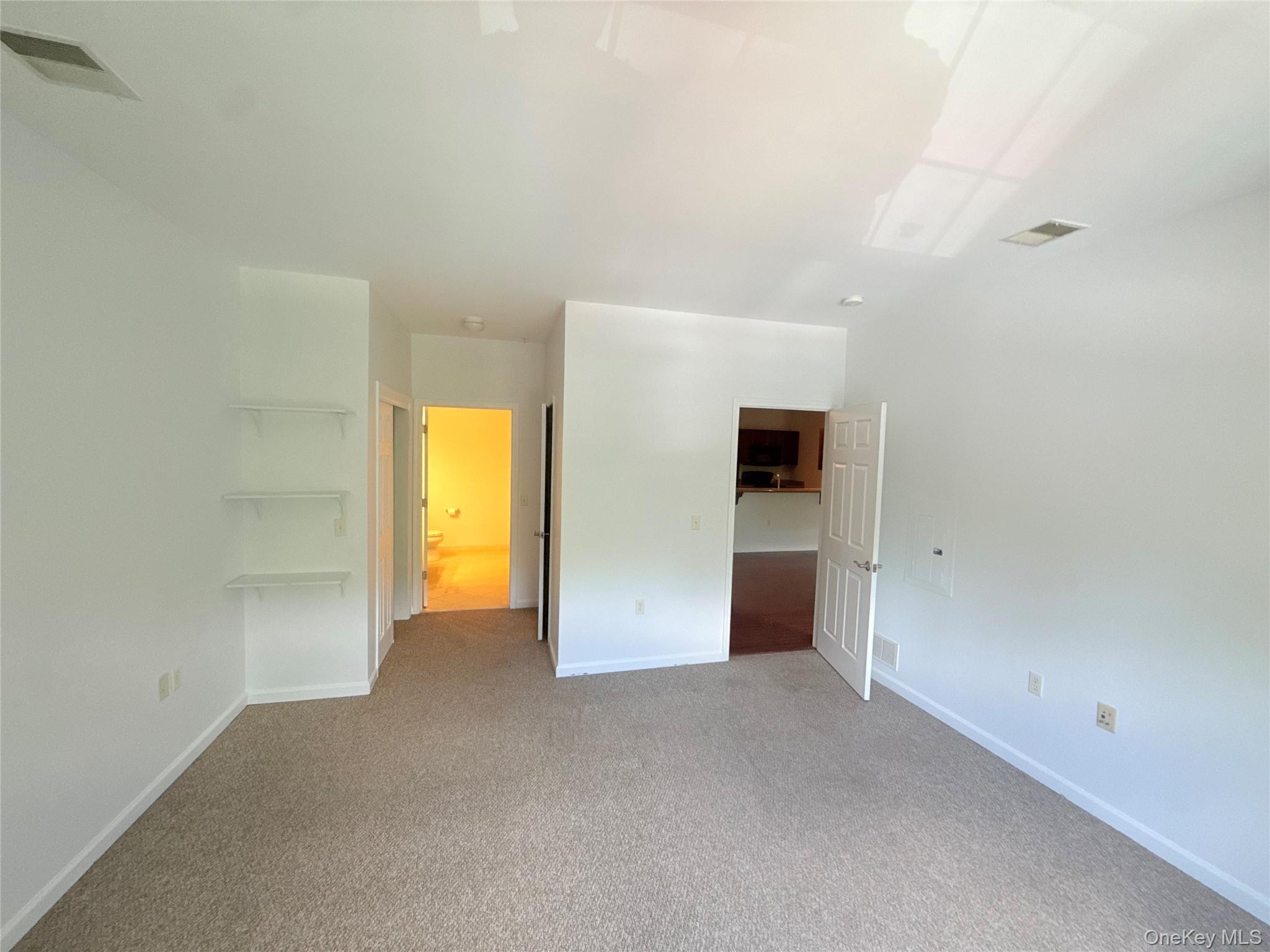 935 Tower Ridge Circle Middletown, NY 10941 - Photo 5 of 24 Carpeted room with a neutral color palette, featuring recessed lighting and a ceiling vent