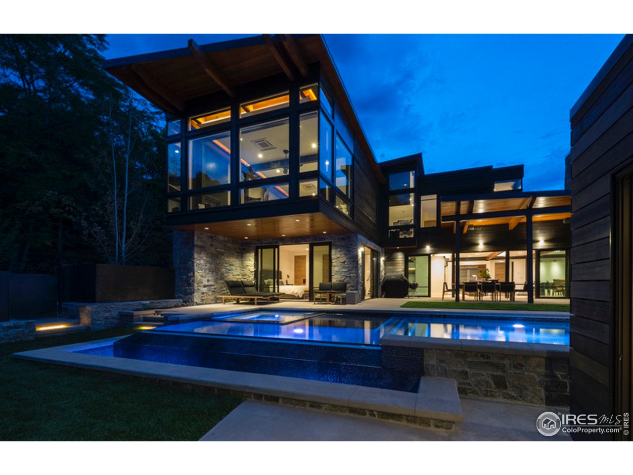 1005 Gilbert Street Boulder, CO 80302 - Photo 1 of 7 a living room with furniture and a fireplace