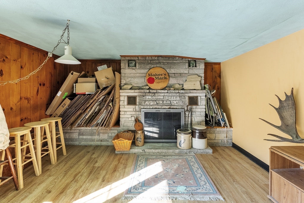 115 Kennedy Road Stoughton, MA 02072 - Photo 33 of 42 a living room with furniture and a fireplace
