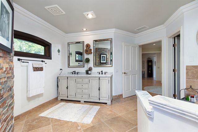 a room with a bed and a television