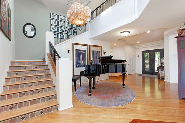 a view of a room with lots of wooden furniture and a view of living room