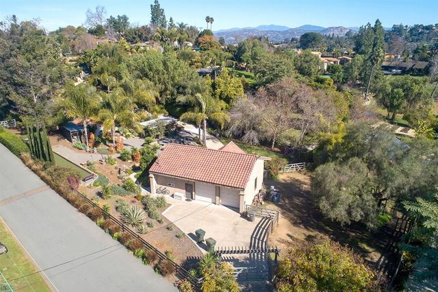 an aerial view of a house with a garden