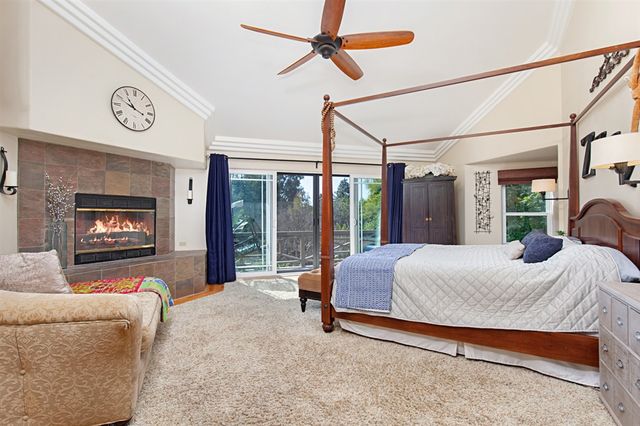 a bed room with a bed and a television