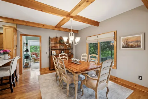 a kitchen with stainless steel appliances granite countertop a sink and a refrigerator