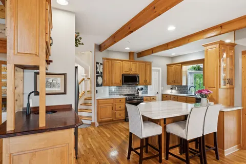 a view of a glass door with wooden floor