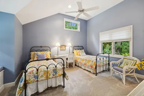 a room with a bed and a table in it