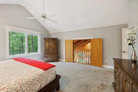 a view of house with deck outdoor seating and yard