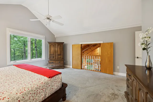 a view of house with deck outdoor seating and yard