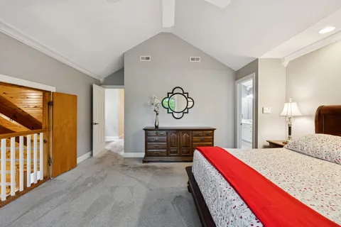 a backyard of a house with a table and chairs