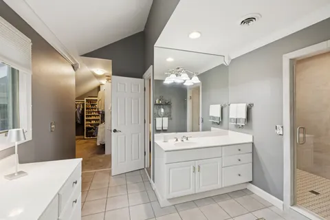 a view of a house with backyard and a tree